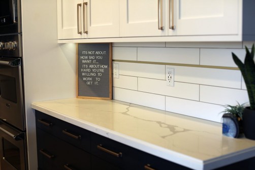 Black Cabinets with White Counters