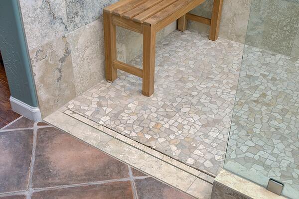 river rock tile floor in newly renovated bathroom