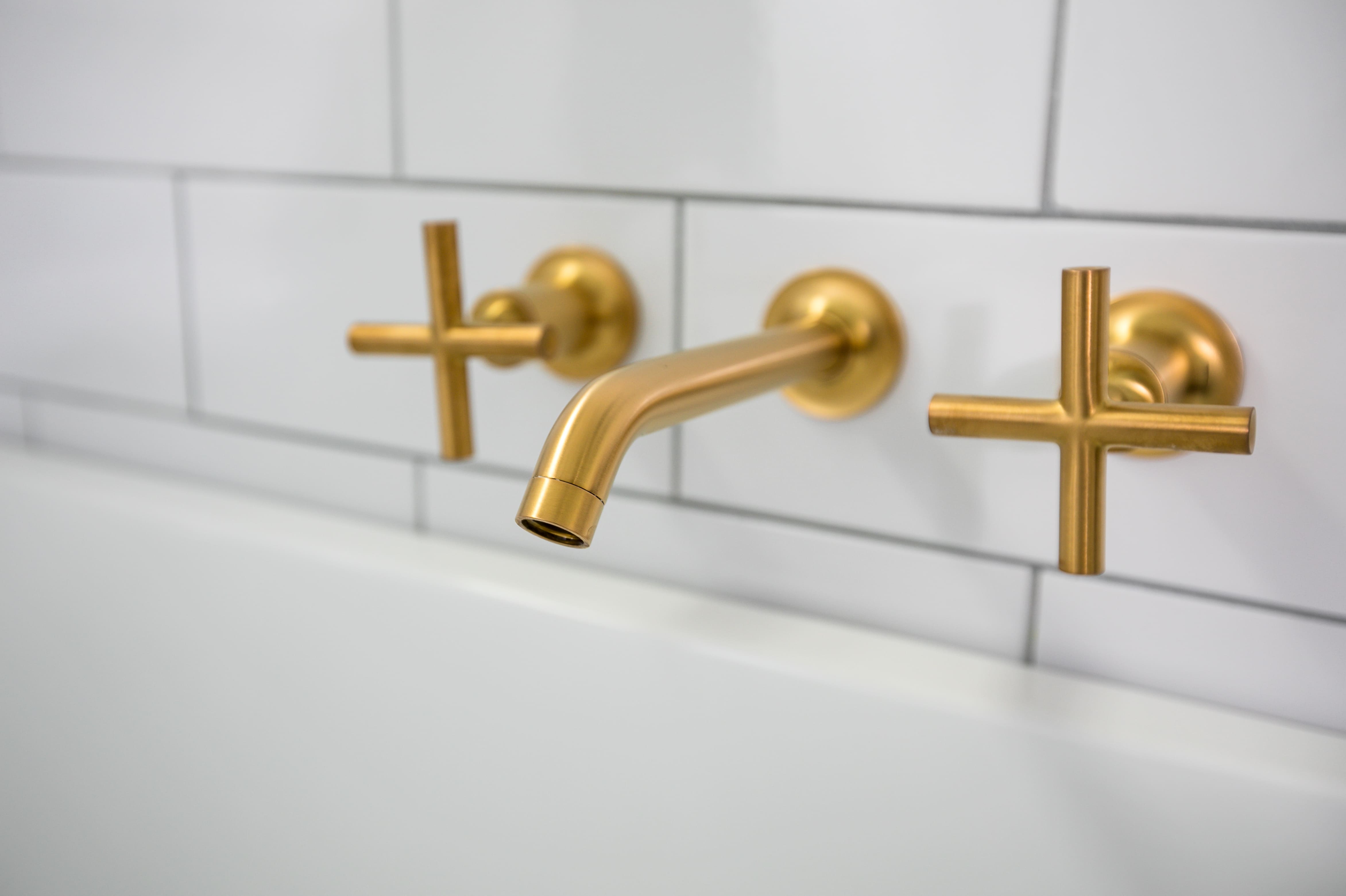 Gold bathroom fixtures by Tempe Remodeling Contractor