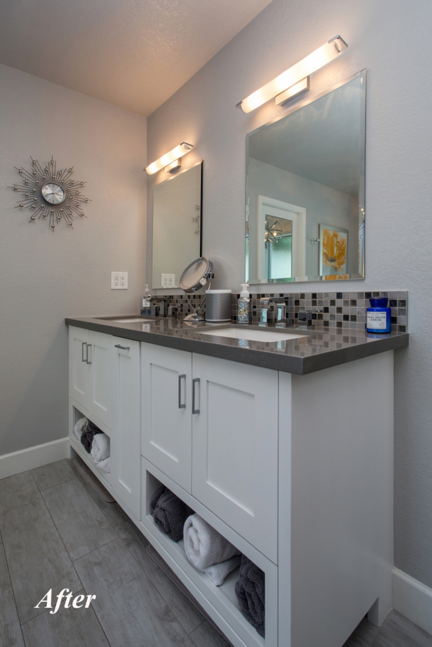 New custom vanity at the Tempe bathroom remodel with white shaker doors, gray quartz countertop, undermount sinks, mosaic backsplash, and double frameless mirrors with chrome sconces.